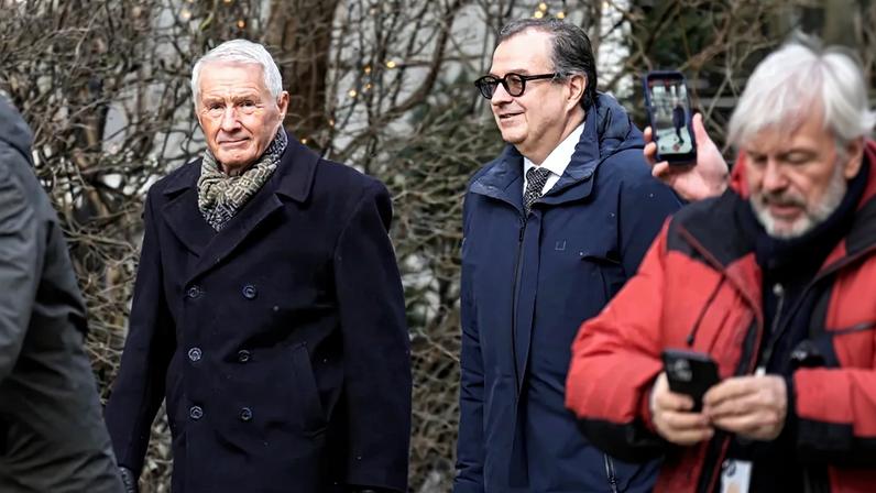 Former Norwegian Prime Minister Thorbjorn Jagland and Anders Brosveet walk in Oslo.