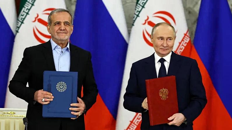 Russian President Vladimir Putin and Iranian President Masoud Pezeshkian sign a strategic partnership treaty during a ceremony following their talks at the Kremlin in Moscow on Jan. 17, 2025.
