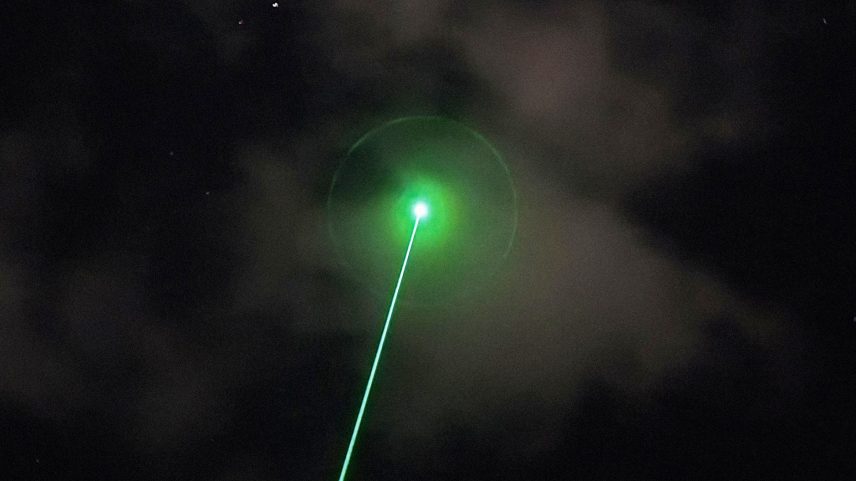 Image may contain Light Laser Flare and Lighting