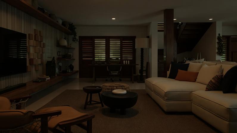 LIVING | O sofá Cannes, da Ovoo, foi composto com poltrona Jangada, de Jean Gillon, pertencente ao acervo da cliente, e o banco Mocho, de Sergio Rodrigues, que enaltecem o design brasileiro. Mesa de centro da Casa Atica e banco Arurog ll da Artefacto Beach & Country. Tapete da Phenicia. A estante, desenhada pelo escritório, foi executada com madeira peroba-rosa de reúso pelo Studio N e expõe os tijolinhos da Coleção Barrolândia, do Instituto Maria do Barro, além de potes sertanejos e panelas vindas do interior da Chapada Diamantina, originalmente usados no preparo de alimentos em fogões a lenha, com curadoria do Casarão Pedro Baiano, que também forneceu a mesa de trabalho, ao fundo, e a luminária de piso, feita com um parafuso de prensa resgatado de uma antiga fábrica de farinha de mandioca e cúpula de juta