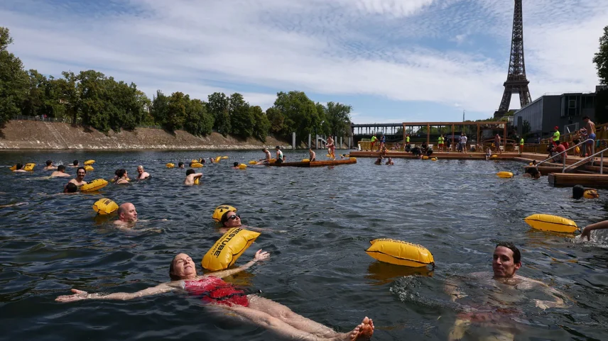 People swim in the Seine River after it reopened to the public in Paris on July 5, 2025.