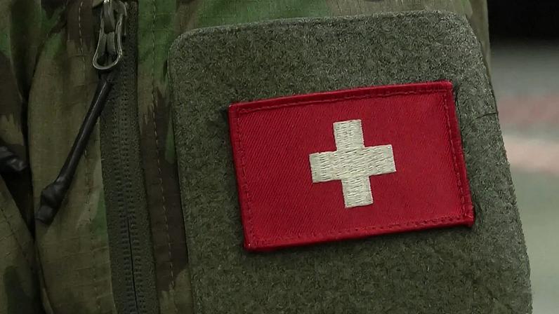 Pull focus insignia on the uniform of Colonel Ludovic Monnerat, commander of the Swiss Army’s satellite.