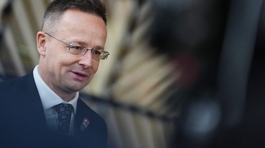 Hungary's Foreign Minister Peter Szijjarto speaks with the media as he arrives for a meeting of EU foreign ministers at the European Council building in Brussels, Monday, Marc