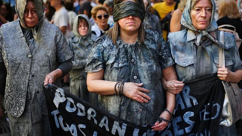 Activists demonstrate during a rally on the anniversary of the coup that brought the military regime (1976-1983) to power, in Buenos Aires, Argentina