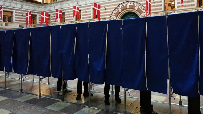 People vote at a polling station at City Hall in Copenhagen, Denmark, on Tuesday, March 24, 2026, during the general election.