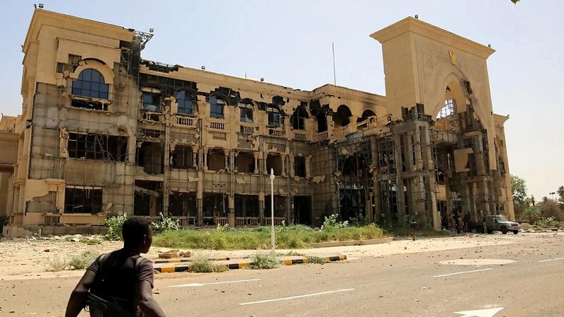 FILE - An army soldier walks in front of the Republican Palace in Khartoum, Sudan, after it was taken over by Sudan's army, 21 March 2025