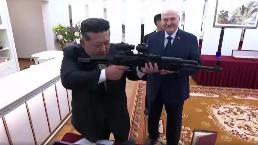 Lukashenko presents an assault rifle and traditional Belarusian products, while Kim Jong Un gifts a sabre, an ornate vase, and a gold commemorative coin.