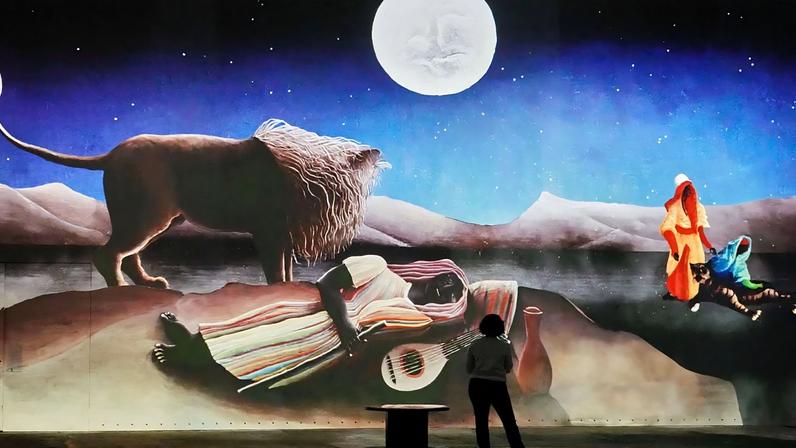 Visitors discover an immersive digital art exhibition dedicated to the naive French painter Henri Rousseau, in Dortmund, on Tuesday 30 September 2025.