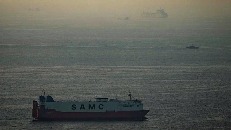 Cargo ships sail in the Arabian Gulf towards Strait of Hormuz in United Arab Emirates, Thursday, March 19, 2026.