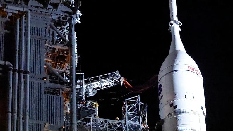 The Orion spacecraft sits on top of the NASA Artemis II rocket in the Vehicle Assembly Building before rollout to pad 39B at the Kennedy Space Center in Cape Canaveral.