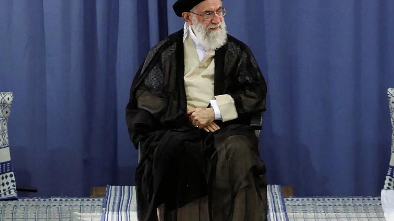 FILE PHOTO: Iranian President Mahmoud Ahmadinejad (R) and Parliament Speaker Ali Larijani (L) listen to a speech by Supreme Leader Ayatollah Ali Khamenei during a ceremony for Ahmadinejad's confirmation as Iran's President in Tehran August 3, 2009. Iran's supreme leader formally approved the second term presidency of Ahmadinejad on Monday after a disputed election that leading reformists say was rigged to ensure the incumbent's victory. REUTERS/khamenei.ir QUALITY FROM SOURCE/File Photo