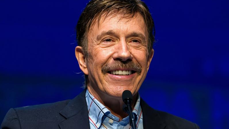 FILE PHOTO: Actor Chuck Norris speaks during the National Rifle Association's 139th annual meeting in Charlotte, North Carolina May 14, 2010. REUTERS/Chris Keane/File Photo