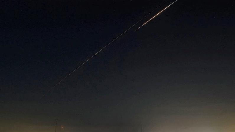 An Iranian missile flies towards Israel, amid the U.S.-Israeli conflict with Iran, as seen from Hebron, in the Israeli-occupied West Bank, March 27, 2026. REUTERS/Mussa Qawasma