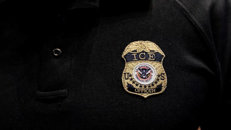 The badge of a U.S. Immigration and Customs Enforcement (ICE) is embroidered on a polo shirt of an ICE employee, at a U.S. Immigration and Customs Enforcement two-day job fair in Texas to help fill vacancies for deportation officers and attorneys, in Arlington, Texas, U.S. August 26, 2025.