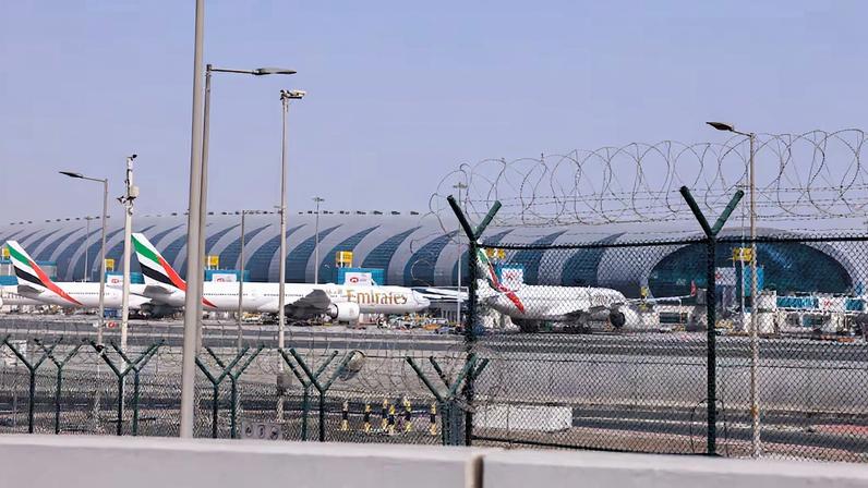 Planes are parked at Terminal 3 of the Dubai International Airport