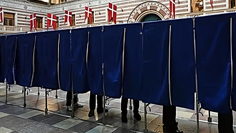 People vote at a polling station at City Hall in Copenhagen, Denmark, on Tuesday, March 24, 2026, during the general election.