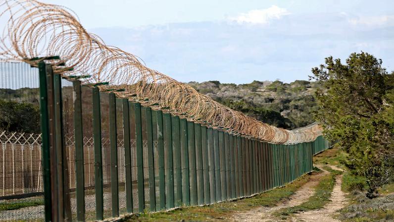 A fence at the entrance of RAF Akrotiri, a British sovereign base in Cyprus that was hit by a drone early Monday, causing limited damage