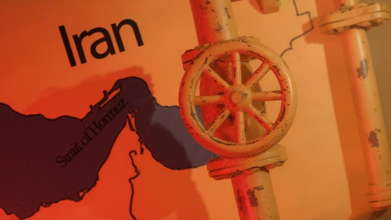 A map showing the Strait of Hormuz and Iran is seen behind a 3D printed oil pipeline in this illustration taken June 22, 2025. REUTERS/Dado Ruvic/Illustration/File Photo
