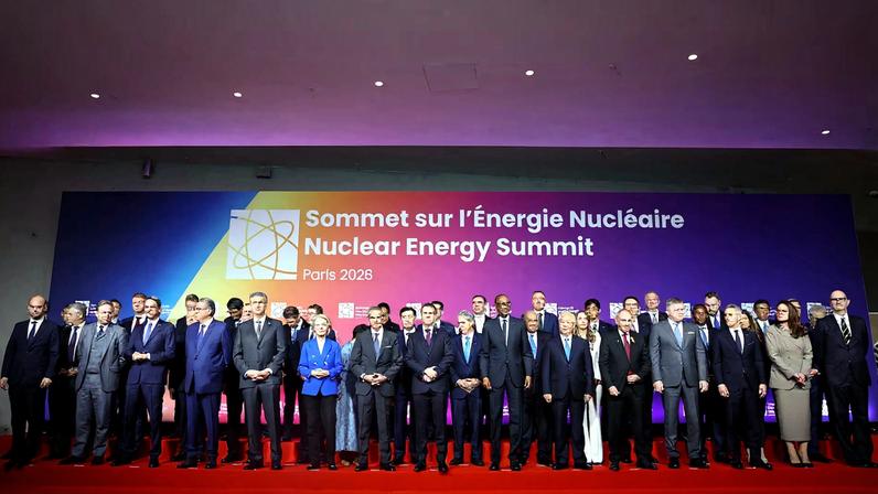 French President Emmanuel Macron and Rafael Grossi, Director General of the International Atomic Energy Agency (IAEA), and European Commission President Ursula von der Leyen pose with heads of state and government for a family photo during the IAEA Nuclear Energy Summit in Paris, France, March 10, 2026.