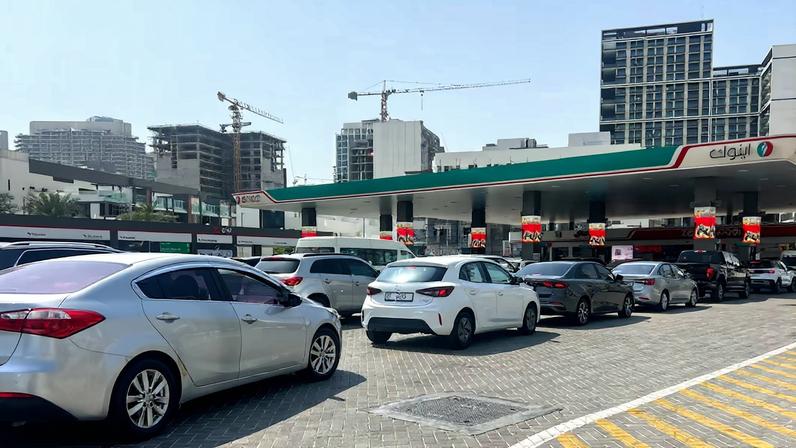 Cars queue outside a petrol station, after an Iranian attack, following United States and Israel strikes on Iran, in Dubai