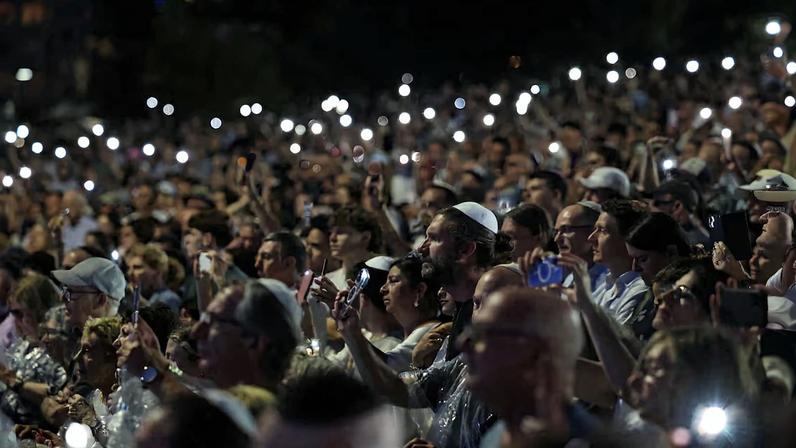 People attend the ‘Light Over Darkness’ vigil in Sydney
