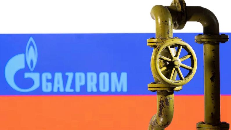 Illustration shows Gazprom logo and Russian flag