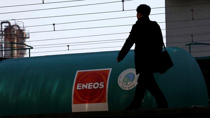 JX Nippon Oil & Energy Corp's Eneos brand logo on a tanker lorry in a train at a station nearby its refinery in Yokohama
