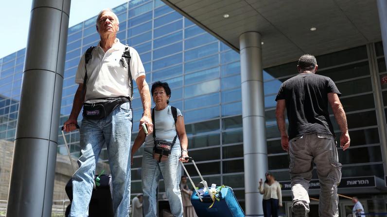 Israeli nationals walk at Ben Gurion International airport as they arrive on the first rescue flight from abroad, after U.S. President Donald Trump announced a ceasefire between Israel and Iran, in Tel Aviv, Israel, June 24, 2025.