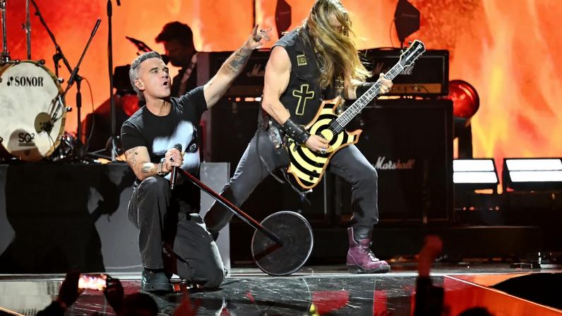 Robbie Williams, Adam Wakeman, Robert Trujillo, Tommy Clufetos and Zakk Wylde perform tribute for Ozzy Osbourne on stage during The BRIT Awards 2026 at Co-op Live on February 28, 2026 in Manchester, England.