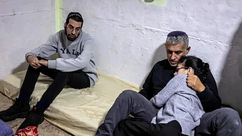 People wait in a bomb shelter during a siren alert for a reported incoming Iranian missile strike near the Israeli coastal city of Tel Aviv, Israel, on March 5.