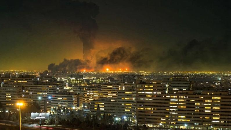 Smoke and flames rise at the site of airstrikes on an oil depot in Tehran.