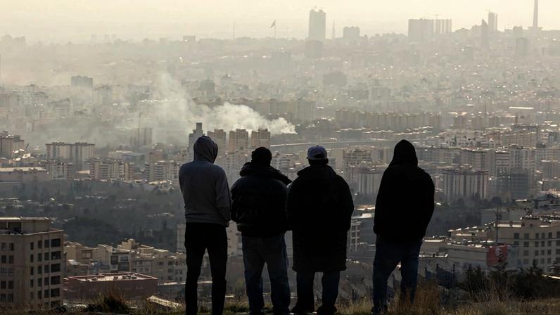 Silhouettes of four men are shown looking over a cityscape with smoke.