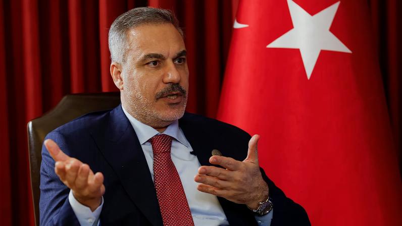 Turkish Foreign Minister Hakan Fidan speaks during an interview with Reuters at the 23rd edition of the annual Doha Forum, in Doha