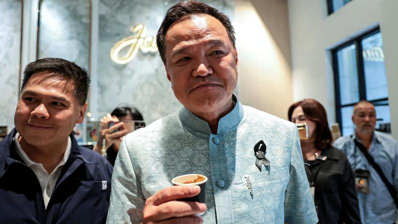 Anutin Charnvirakul, Thailand's caretaker Prime Minister, Bhumjaithai Party leader and prime ministerial candidate, reacts as he drinks coffee ahead of a meeting with party members at Bhumjaithai Party headquarters, after the party won the general election, in Bangkok, Thailand, February 12, 2026. REUTERS/Chalinee Thirasupa