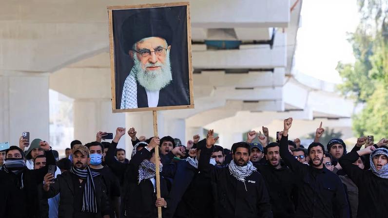 Supporters of Iraqi Shi'ite armed groups gather after the killing of Iran's Supreme Leader Ayatollah Ali Khamenei, in Baghdad