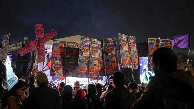 Supporters of Colombian presidential candidate Ivan Cepeda hold campaign posters with his picture as they attend the closing ceremony of the Historic Pact (Pacto Historico) campaign at Plaza de Bolivar in Bogota