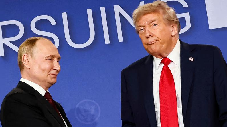 U.S. President Donald Trump looks on next to Russian President Vladimir Putin during a press conference following their meeting to negotiate an end to the war in Ukraine, at Joint Base...