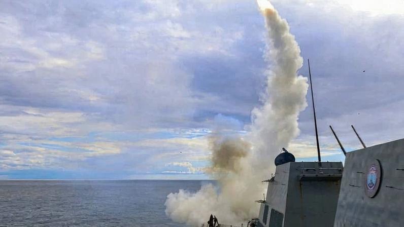 A missile can be seen being fired from a U.S. warship.