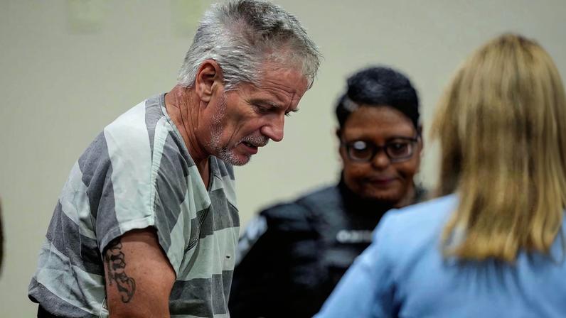 Colin Gray, 54, the father of Apalachee High School shooter Colt Gray, 14, who is charged as an adult with four counts of murder in the deaths of Mason Schermerhorn and Christian Angulo, both 14, Richard Aspinwall, 39, and Cristina Irimie, 53, enters the Barrow County courthouse for his first appearance, in Winder, U.S., September 6, 2024.