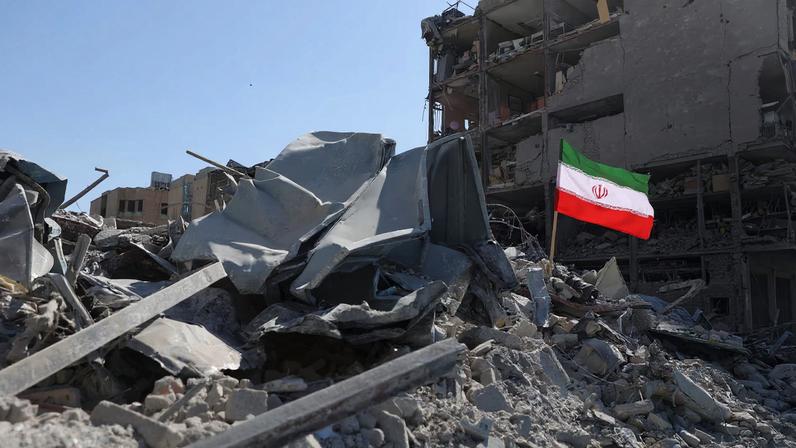 The national flag of Iran flies in the wind as debris lies scattered in the aftermath of an Israeli and U.S. strike on a police station, amid the U.S.-Israeli conflict with Iran, in Tehran, Iran, March 3, 2026. Majid Asgaripour/WANA (West Asia News Agency) via REUTERS