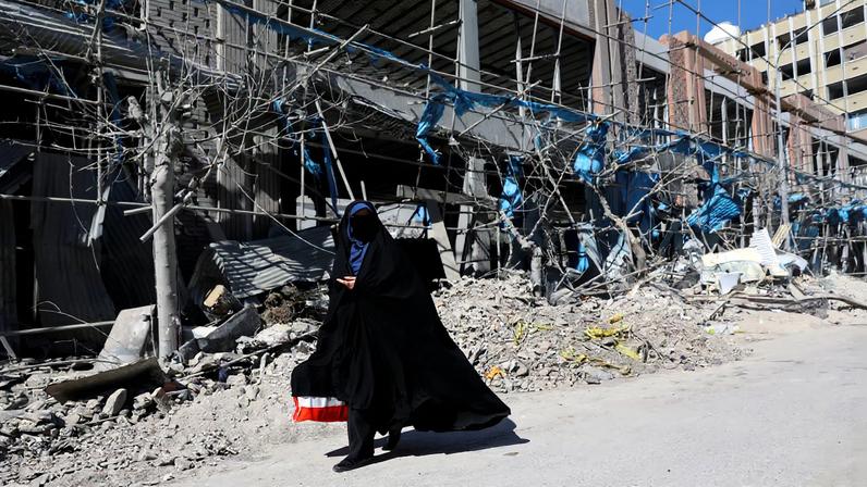A woman walks on the street following an Israeli and U.S. strike on a police station, amid the U.S.-Israeli conflict with Iran, in Tehran, Iran, March 3, 2026. Majid Asgaripour/WANA (West Asia News Agency) via REUTERS