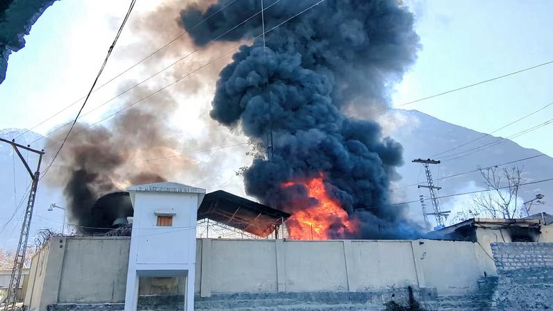 Smoke and flames rise from the premises of U.N. office, after it was set ablaze by protesters, following news of U.S. and Israeli strikes on Iran that killed supreme leader Ayatollah Ali Khamenei, in the city of Gilgit