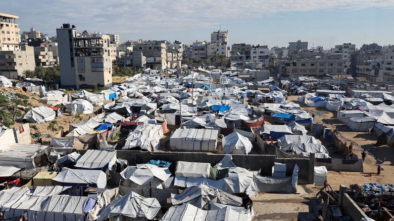 Palestinians displaced during the two-year Israeli offensive, shelter at a tent camp in Gaza City, March 1, 2026. REUTERS/Dawoud Abu Alkas