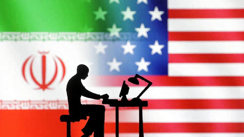 Figurines with computers are seen in front of U.S. and Iran flags in this illustration taken, September 10, 2022. REUTERS/Dado Ruvic/Illustration/File Photo