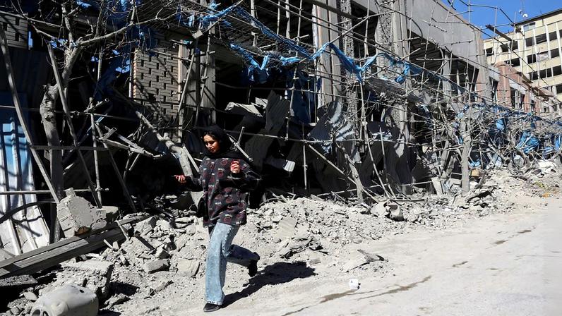 A woman walks on the street following an Israeli and U.S. strike on a police station, amid the U.S.-Israeli conflict with Iran, in Tehran, Iran, March 3, 2026. Majid Asgaripour/WANA (West Asia News Agency) via REUTERS