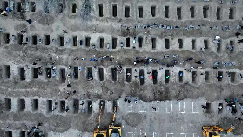 Graves are being prepared for the victims following an Israeli strike on a school in Minab
