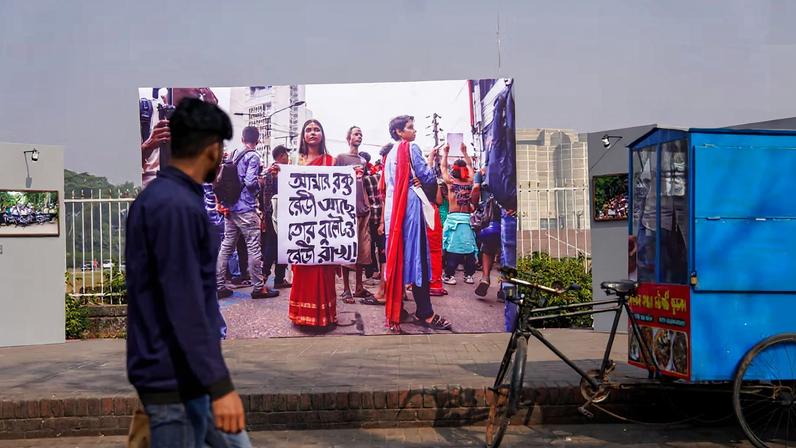 Taking it to the streets: life-sized photographs of protest on the sidewalk during the Chobi Mela photography festival
