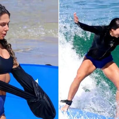 Carol Portaluppi pratica surfe em dia de praia no Rio