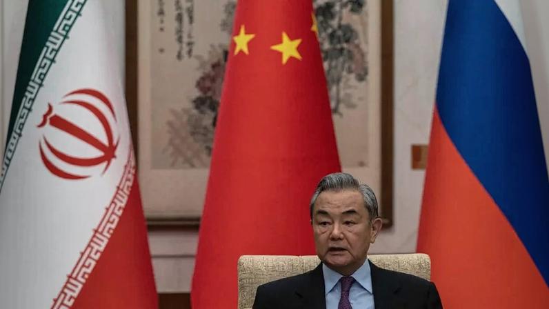 Chinese Foreign Minister Wang Yi speaks during a meeting on the Iranian nuclear issue in Beijing on March 14, 2025.
