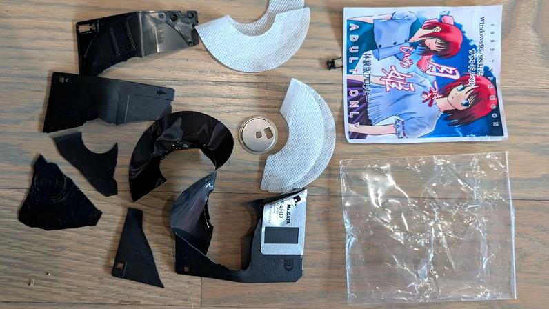 The destroyed floppy and box art.